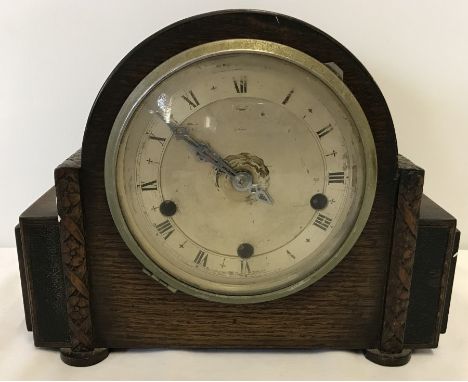A wooden cased Westminster chime Art Deco mantle clock with key and pendulum.  