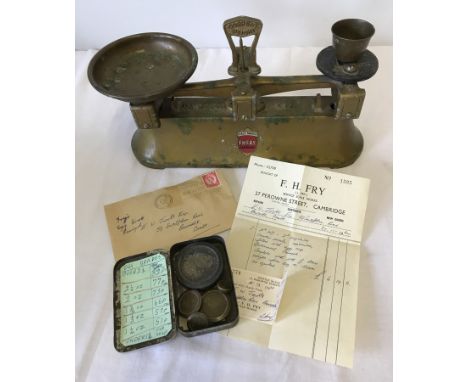 A set of vintage metal egg scales by F.H. Fry, Cambridge. Complete with weights and original receipt. 