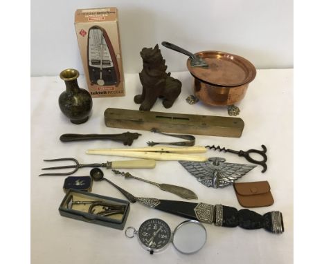 A box of assorted misc items to include a car mascot and Metronome.  