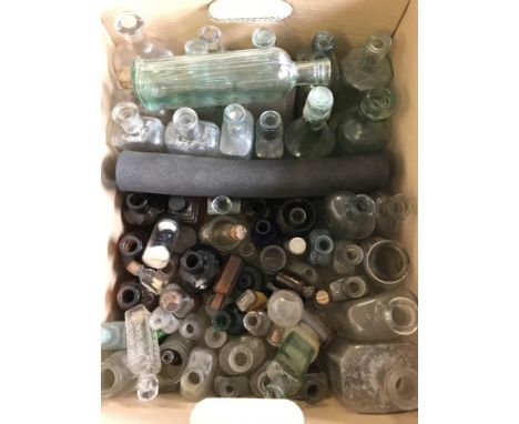 A box of vintage veterinary and farming pharmaceutical  bottles. To include coloured glass. 