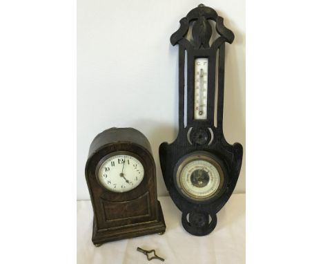A vintage barometer and mantle clock  