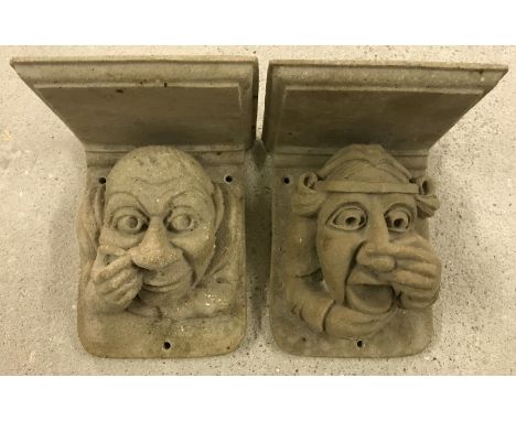 A pair of stone composite gargoyle candle / shelf brackets. One with repaired crack to back plate. Each 14.5cm tall x 11.5cm 