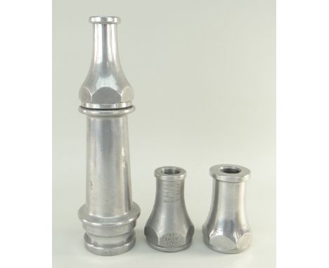 FIRE BRIGADE INTEREST: Vintage aluminium short hose branch and 5/8in. nozzle, 29.5cm; and two 1 1/8 in. nozzles, one dated 19