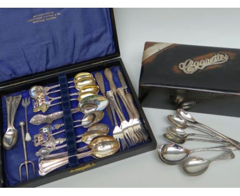 ASSORTED SILVER &amp; ENAMEL SOUVENIR SPOONS, six silver gateau forks, other spoons and a silver mounted ebonized walnut ciga