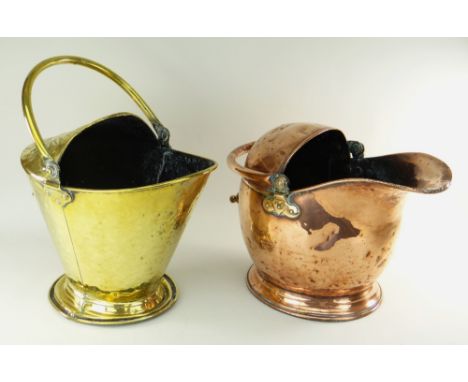 TWO EARLY 20TH CENTURY COAL SCUTTLES one copper helmet shaped scuttle and a brass Arts &amp; Crafts decorated scuttle, both w