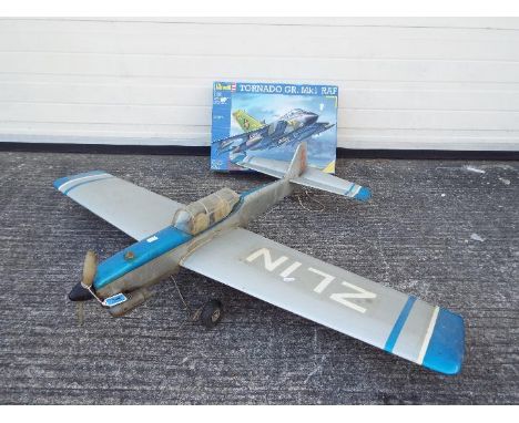 Revell, Other - A circa 1980's kit built model RC plane with petrol engine. The plane measures approximately 100cms in length