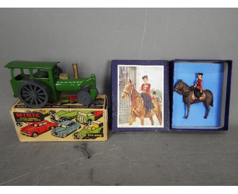 Minic, Britains - A boxed Minic plastic and tinplate steam roller with a metal figure of HM the Queen. The model in green wit