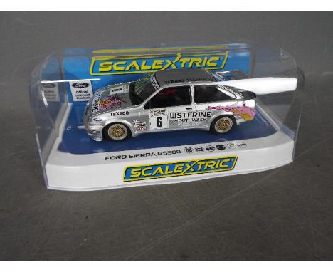 Scalextric - A Ford Sierra RS500 Cosworth in Graham Goode / Listerine Racing livery. # C4146. The car appears Mint in a Very 