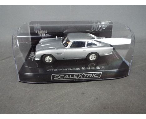 Scalextric - James Bond - An Aston Martin DB5 from No Time To Die. # C4202. The car appears Mint in a Very Good display case 