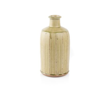 Phil Rogers (1951-2020)Bottle vasewith a green ash glaze and cut sidesimpressed potter's seal to the footrim21cm high.