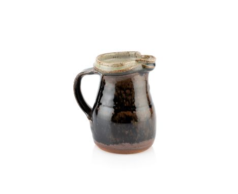 Richard Batterham (1936-2021)Small jugwith tenmoku glazeunmarked15cm high.  Overall seems ok with only minimal glaze or firin