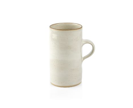 Lucie Rie (1902-1995)Coffee mugcream glazeimpressed potter's seal11.5cm high.  The faintest of hairline cracks from the top r