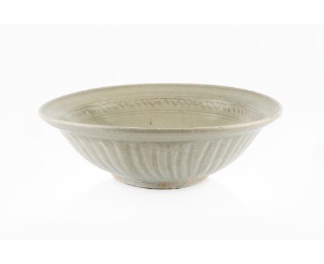 In the manner of Katharine Pleydell-Bouverie (1895-1985) Bowlwith combed decoration to the interior rim, crackled celadon gla