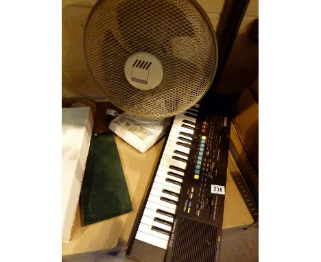 Casio electric organ and a desk fan