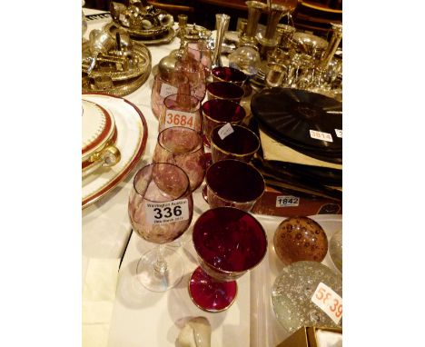 Two sets of six pink and ruby glass drinking glasses 