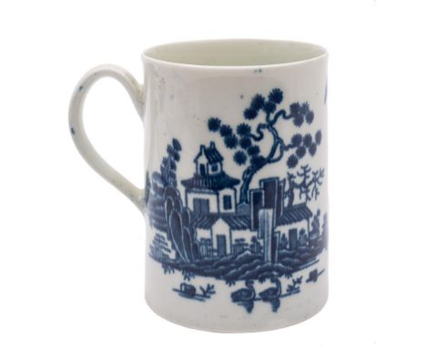 A First Period Worcester blue and white mug: of tapering cylindrical form with slightly everted rim and ribbed strap handle, 