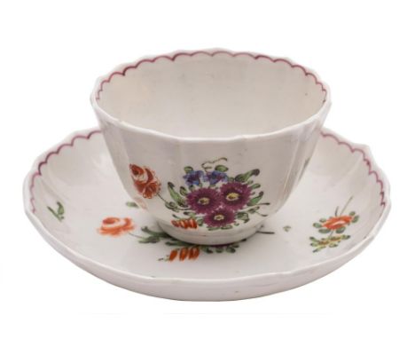 A Bristol [Richard Champion] fluted teabowl and saucer: painted with floral sprays and sprigs and puce loop borders, circa 17