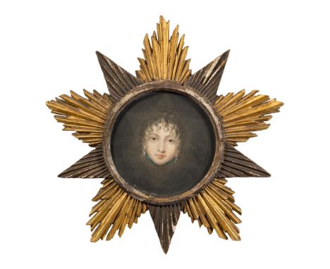 A carved and gilded wood 'Starburst' picture frame,:- aperture 14.5cm diameter, containing a printed portrait.
