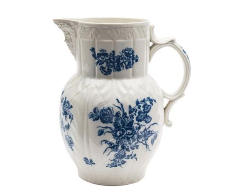 A large Caughley blue and white cabbage leaf mask-head jug: printed in the 'Bouquets' pattern, circa 1780, 23cm.