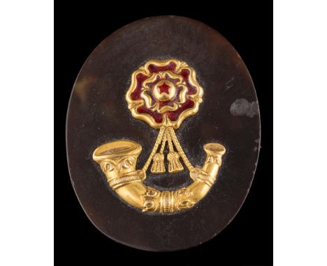A tortoiseshell and enamel Light Infantry military badge/brooch: the oval tortoiseshell panel with enamel rose and applied ho