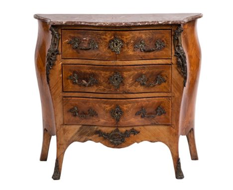 A 19th Century French kingwood, marquetry and gilt metal mounted serpentine fronted bombe commode:, with a rouge variegated m