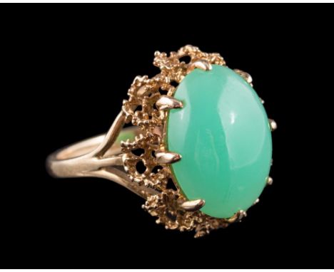 A 9ct gold and jade single-stone ring: the oval jade approximately 16mm long x 11.5mm wide, ring size Q 1/2. 