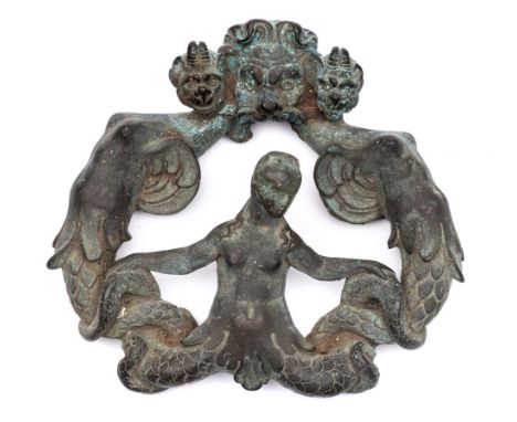 A late 16th/early 17th century bronze door knocker: in the form of grotesque sea monsters and mermaid, 21cm high.