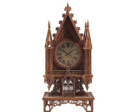 A Gothic mantel clock constructed from cigar boxes: the silvered dial with black Roman numerals, now fitted with a quartz mov