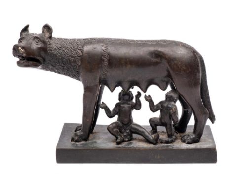 A late 19th/early 20th century bronze group of Romulus and Remus: the two infants suckling on the she-wolf 16cm. 