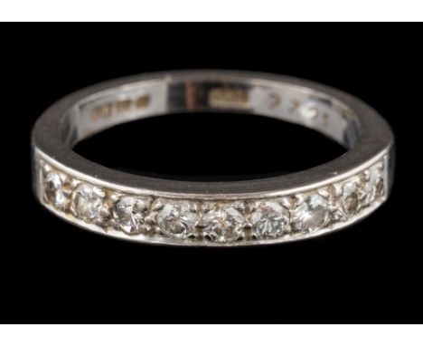 An 18 carat white gold and diamond half hoop ring: pave-set with round brilliant-cut diamonds, total diamond weight approxima