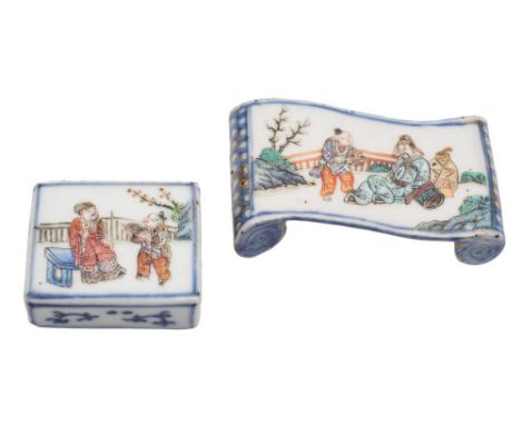 A Chinese famille rose brush rest and a similar water dropper: the brush rest of scroll form, painted with a dignitary and at