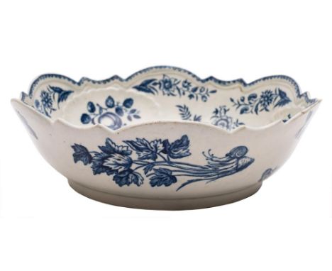 A First Period Worcester blue and white junket/salad bowl: with shaped rim and moulded with shells, printed in 'The Pine Cone