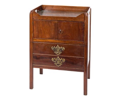 A George III mahogany adapted tray top commode:, the shaped top with carrying handles, enclosed by a pair of boxwood strung p