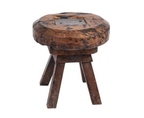 A circular rustic stool, being the cap of the Old Clock Tower, Ottery St Mary Church:, the top with inset lead plaque inscrib