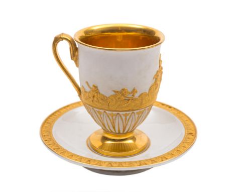 A Meissen Empire white and gilt cabinet cup and saucer: in neo-classical style, the cup with burnished gilt interior and foot