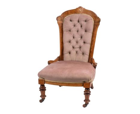 A Victorian walnut and inlaid nursing chair:, bordered with boxwood lines and decorated with paterae, having upholstered butt