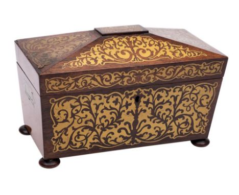 A Regency rosewood and brass inlaid tea caddy: of sarcophagus outline, the hinged lid enclosing two lidded compartments enclo
