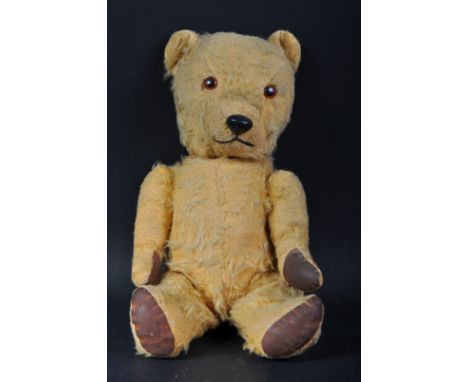 A vintage believed Chiltern / Chad Valley soft toy teddy bear. A golden mohair example with beaded eyes, wax nose and stitche