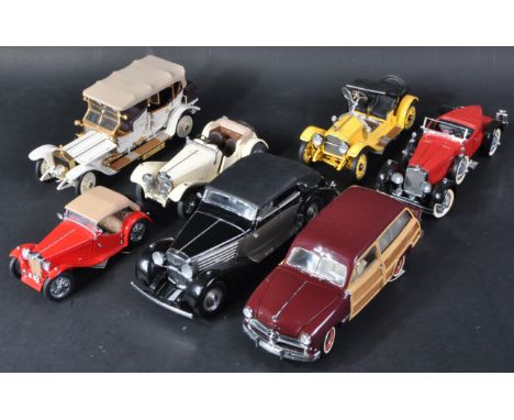 A collection of x7 assorted Franklin Mint 1/24 scale precision diecast model cars to include; 1949 Ford Woody Wagon, 1939 May