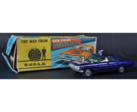 An original vintage Corgi Toys diecast model No. 497 The Man From U.N.C.L.E Gun Firing Thrush Buster. The Oldsmobile Super 88