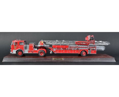 An original Franklin Mint 1/32 scale precision diecast model of a 1965 Seagrave Fire Engine. The detailed model with ariel la