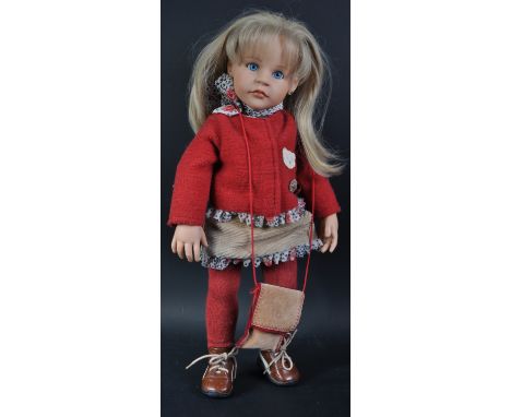 An original circa 2003 Gotz made for Steiff vinyl doll ' Giselle '. The doll with blonde hair, blue glass eyes, eyelashes, fi