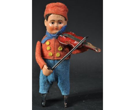 A vintage circa 1930s German Schuco made tinplate clockwork / mechanical violin boy. Tin plate structure with felt clothes an