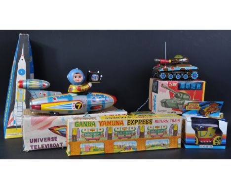 A collection of x6 vintage mechanical tinplate clockwork and battery operated toys. Largely of Japanese / Chinese makers to i