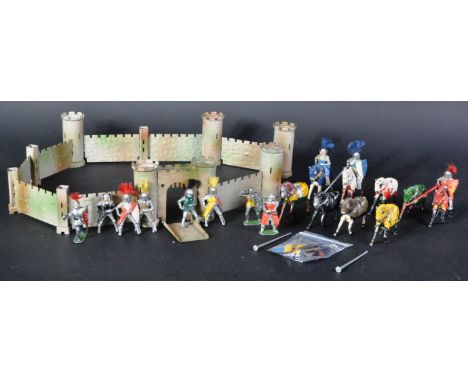 A collection of vintage Britain's lead toy soldier Knights and a Crescent Toys tin plate castle. The knights on horseback wit