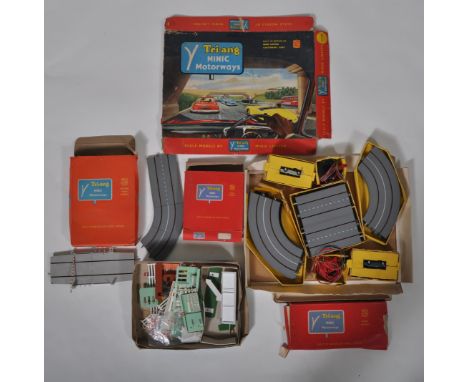 A collection of vintage Triang / Tri-ang Minic Motorways HO / 00 gauge slot car racing playset and accessories. The collectio
