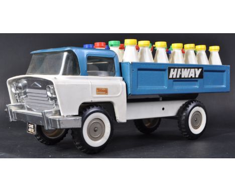 An original vintage Triang / Tri-ang pressed tinplate Highway Milk Truck model. The model with black rubber wheels, blue and 