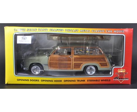 An original boxed Motor City Classics 1/18 scale 1949 Ford Woody Station Wagon Seamist Green Surf Shop. Detailed model with x