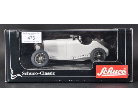 A Schuco Classic made tinplate clockwork model No. 06000 ' Studio V Mercedes Benz SSK/L '. White, with detailed dash board. A