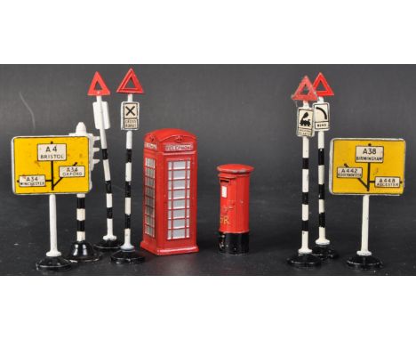 A collection of vintage Dinky Toys miniature diecast roadside accessories comprising telephone box, letter box, traffic light